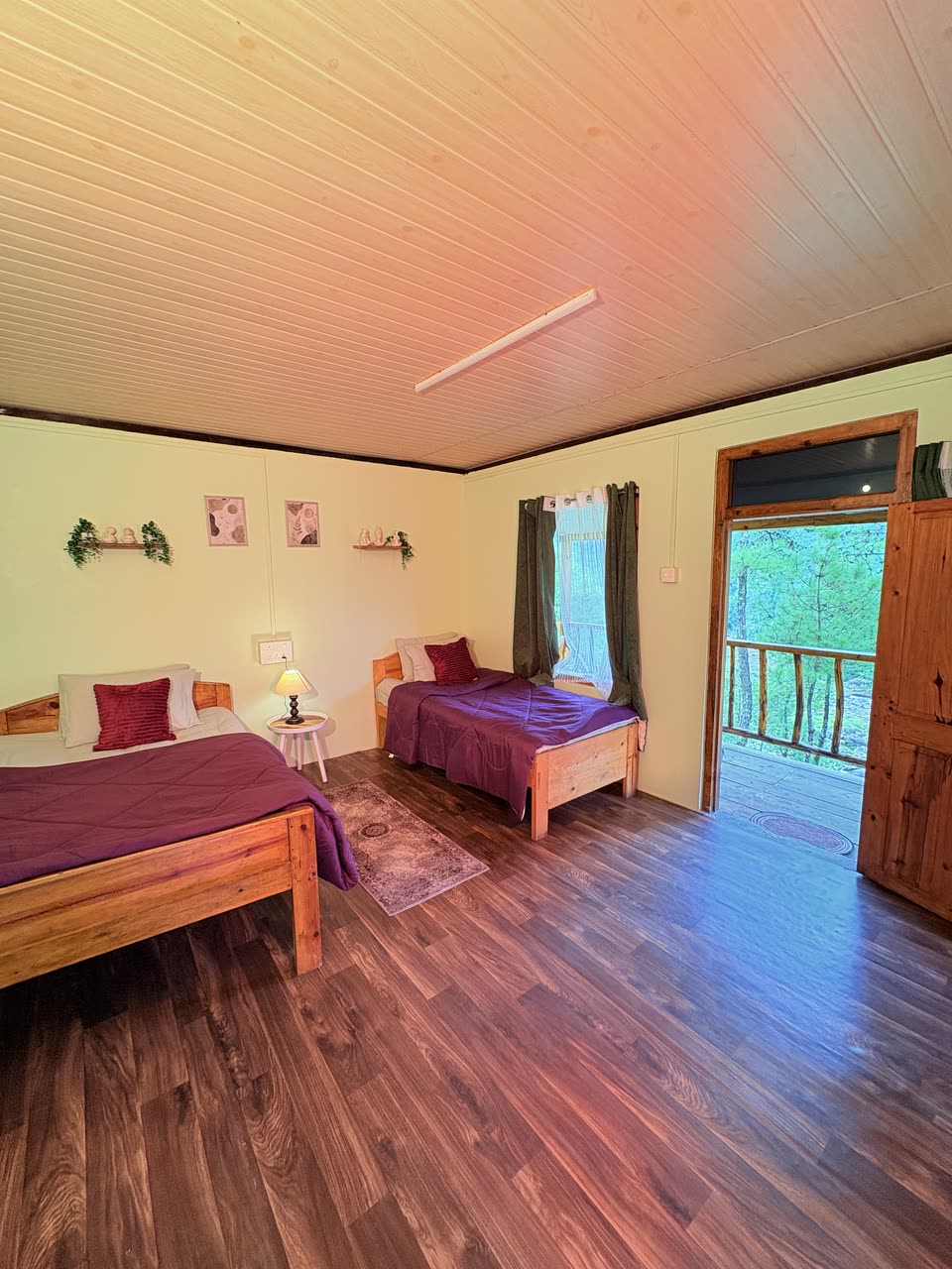 Twin beds with red cushions